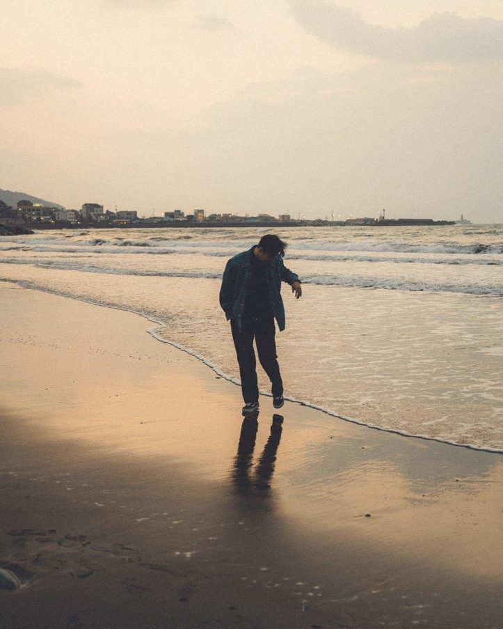 Walking on wet sand, looking down
