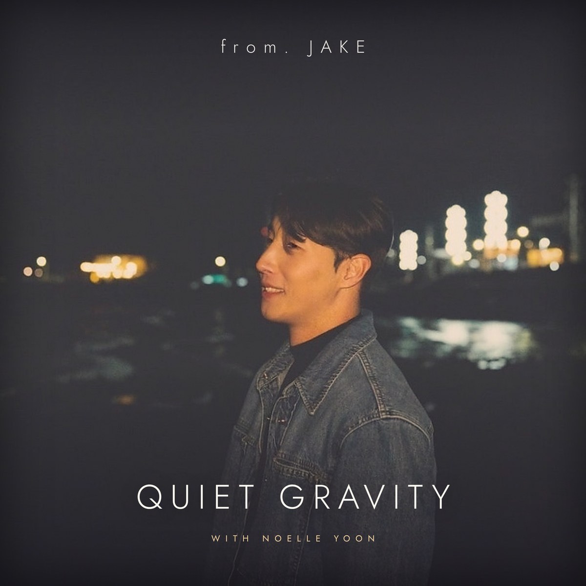 Quiet Gravity cover: from. JAKE by the sea at night, city lights behind